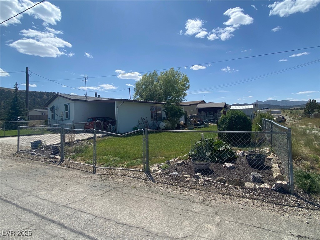 18 Pine Street Ruth, NV 89319 - Photo 1 of 12 Ranch-style home with concrete driveway and an attached carport