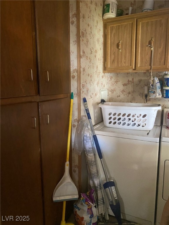 18 Pine Street Ruth, NV 89319 - Photo 6 of 12 Washroom featuring wallpapered walls, washing machine and clothes dryer, and cabinet space