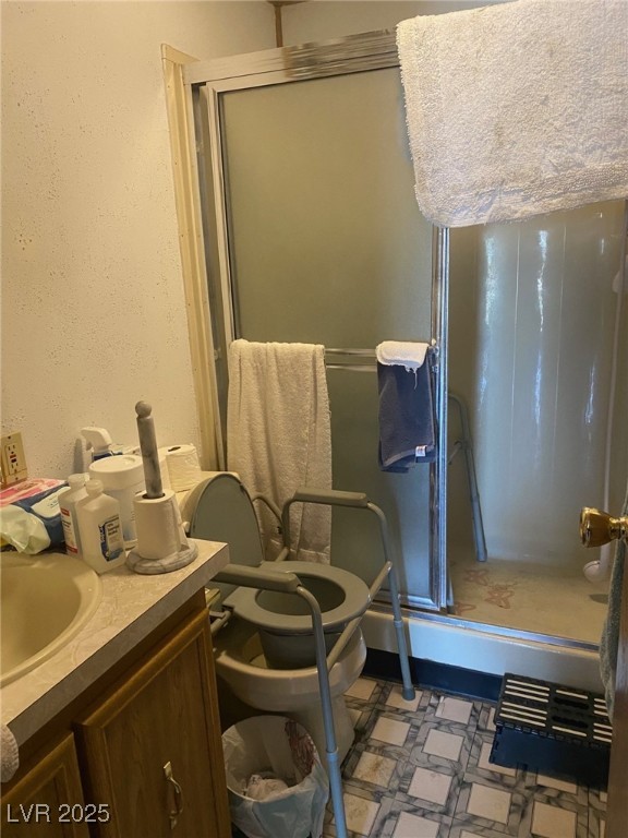 18 Pine Street Ruth, NV 89319 - Photo 9 of 12 Full bathroom featuring a shower stall, tile patterned floors, and vanity