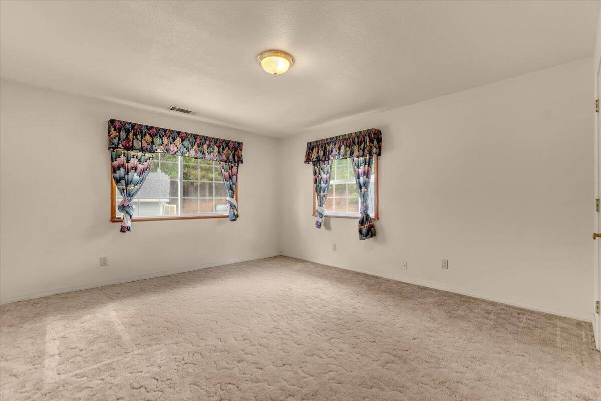30153 Frisby Road Oak Run, CA 96069 - Photo 28 of 56 an empty room with windows and mirror