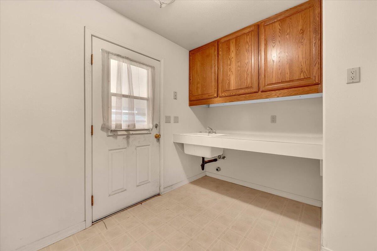 30153 Frisby Road Oak Run, CA 96069 - Photo 32 of 56 a view of an empty room with cabinet door