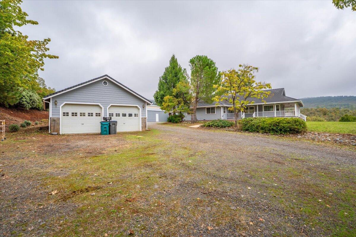 30153 Frisby Road Oak Run, CA 96069 - Photo 40 of 56 a view of a house with a big yard and large trees