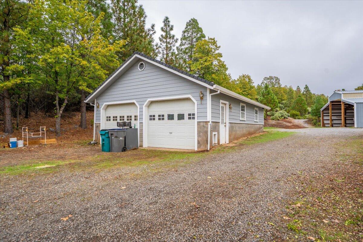 30153 Frisby Road Oak Run, CA 96069 - Photo 41 of 56 a view of a house with a yard and garage