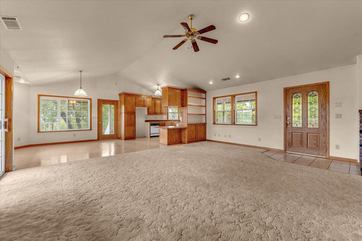 30153 Frisby Road Oak Run, CA 96069 - Photo 10 of 56 a view of an empty room with a window and a kitchen