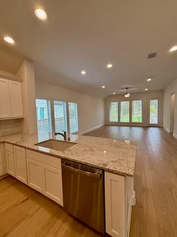 a kitchen with granite countertop sink and granite top