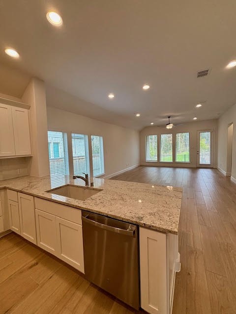 14910 Slough View Court Magnolia, TX 77354 - Photo 12 of 37 a kitchen with granite countertop sink and granite top