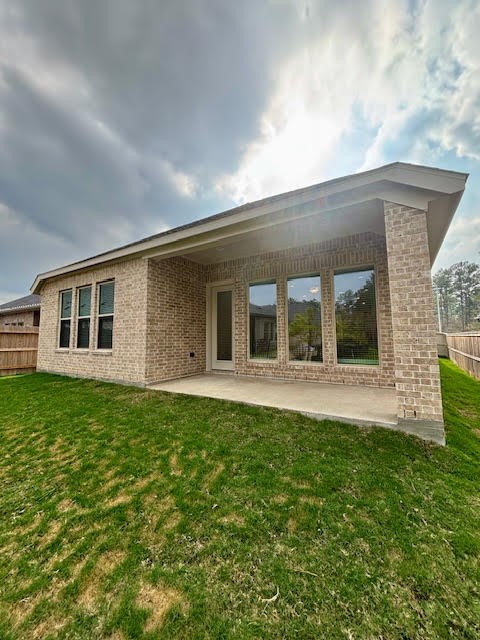 14910 Slough View Court Magnolia, TX 77354 - Photo 29 of 37 a front view of a house with a garden