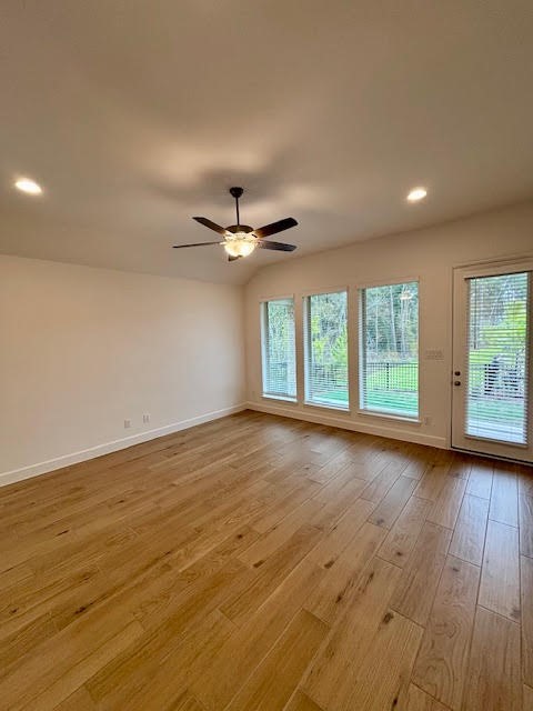 14910 Slough View Court Magnolia, TX 77354 - Photo 10 of 37 a view of an empty room with wooden floor closet and windows