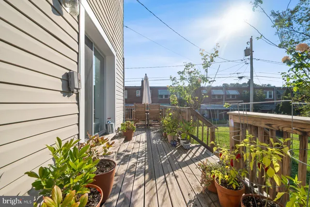 a view of a house with a backyard and sitting area