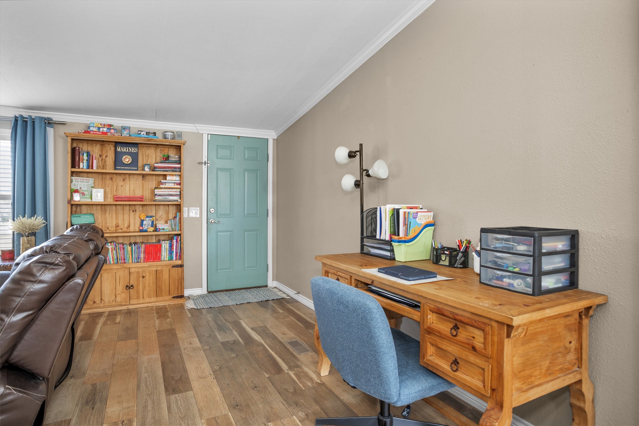 14604 Hasara Lane Willis, TX 77378 - Photo 16 of 50 a room with furniture and a wooden floor