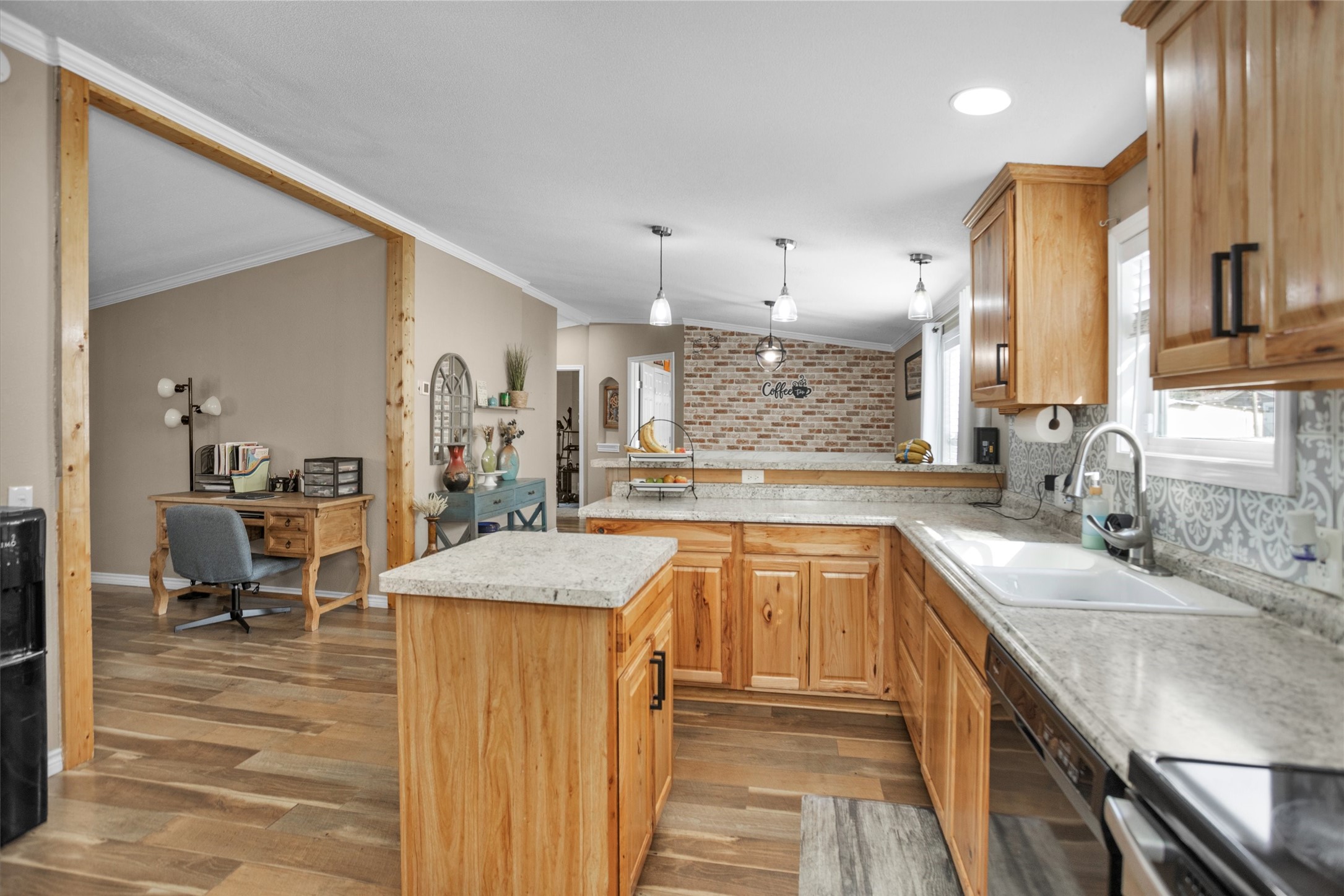 14604 Hasara Lane Willis, TX 77378 - Photo 19 of 50 a kitchen with a sink stove and chairs
