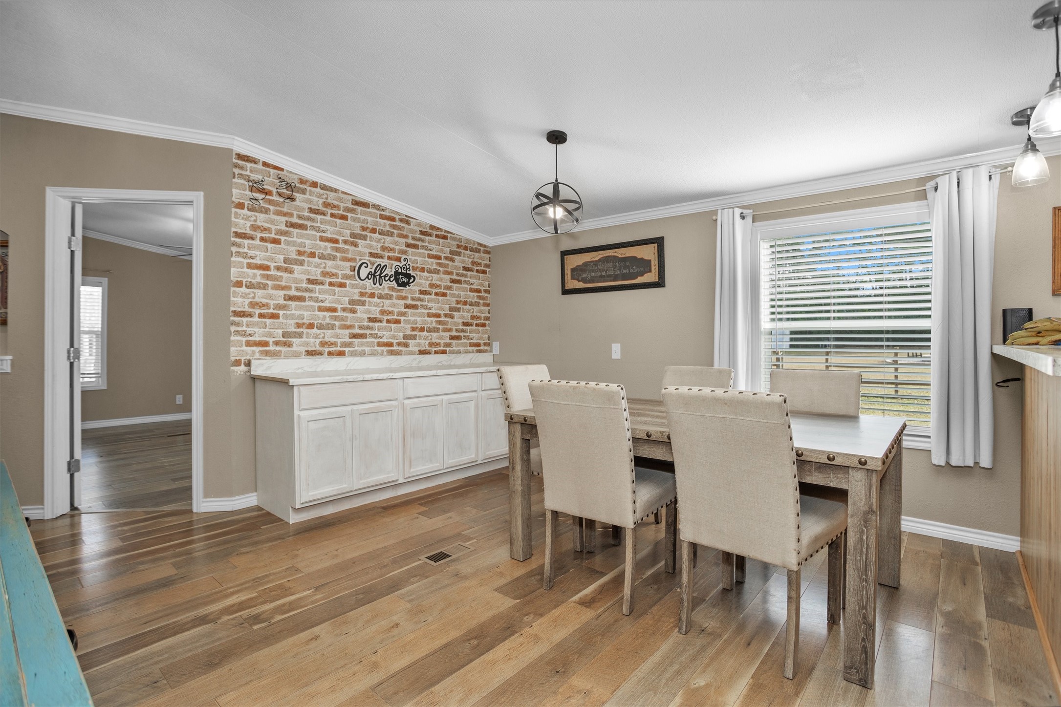 14604 Hasara Lane Willis, TX 77378 - Photo 23 of 50 a view of a dining room with furniture window and wooden floor