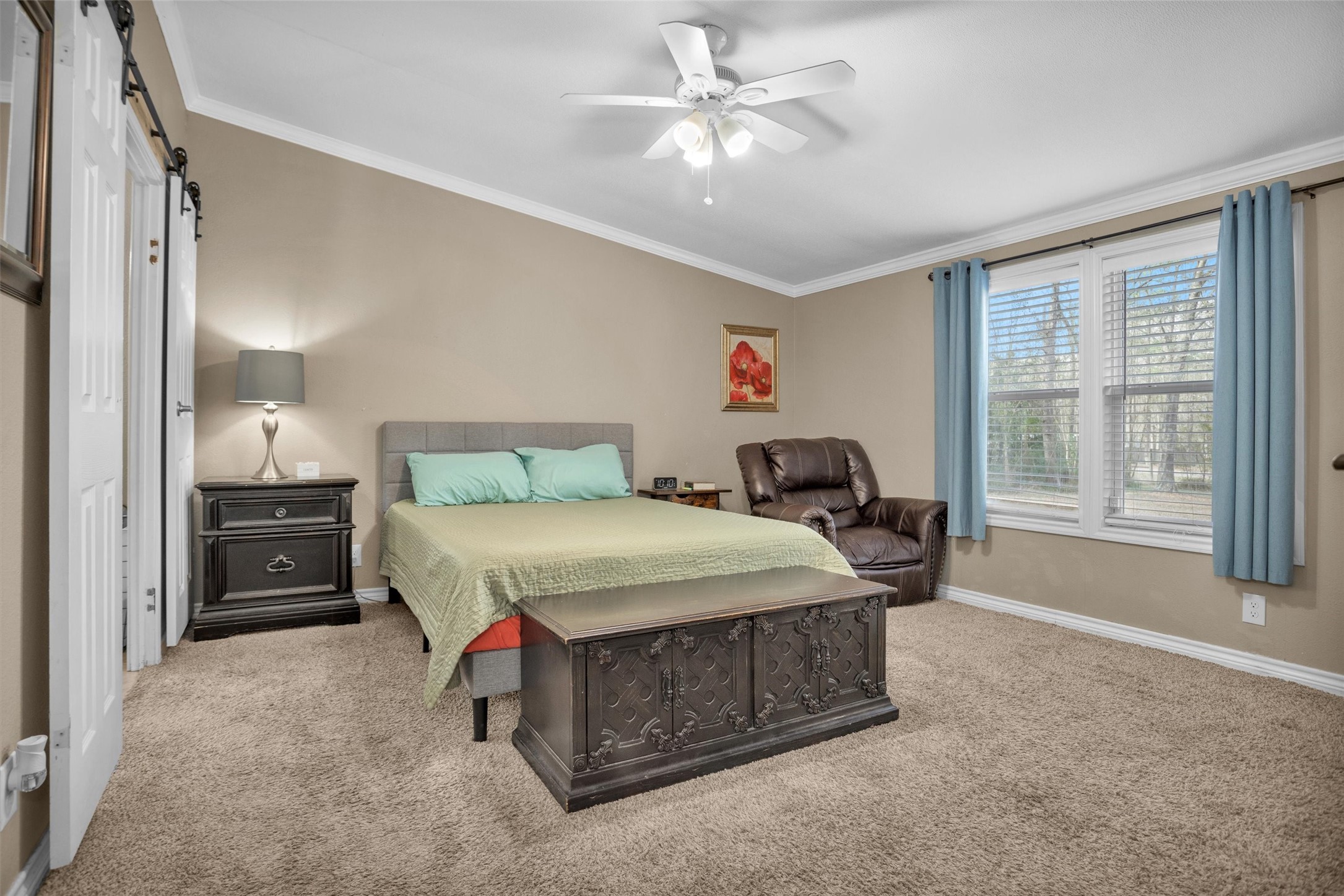 14604 Hasara Lane Willis, TX 77378 - Photo 25 of 50 a spacious bedroom with a bed and a large window
