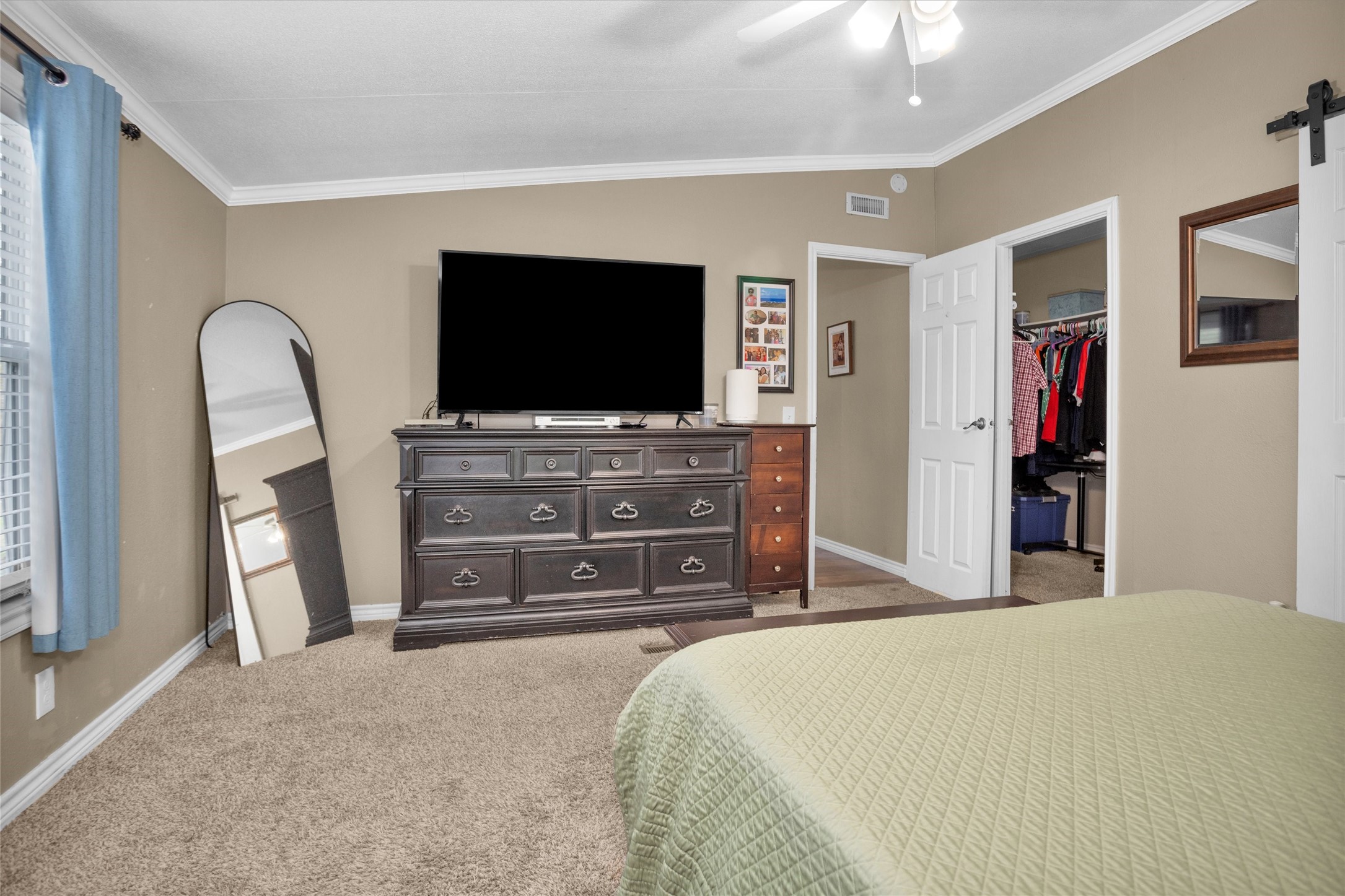 14604 Hasara Lane Willis, TX 77378 - Photo 26 of 50 a bedroom with a bed and a flat screen tv