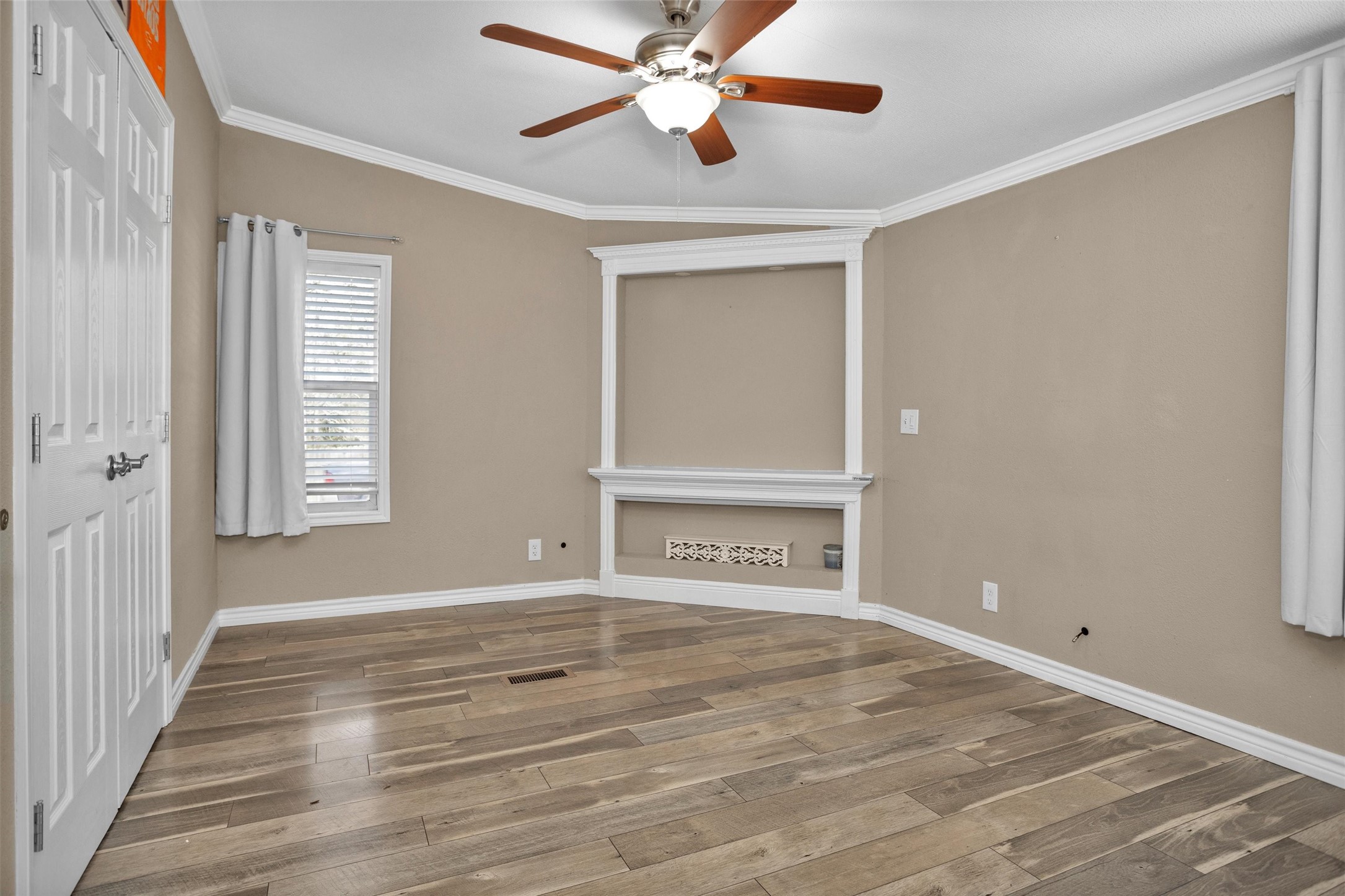 14604 Hasara Lane Willis, TX 77378 - Photo 31 of 50 a view of an empty room with window and wooden floor