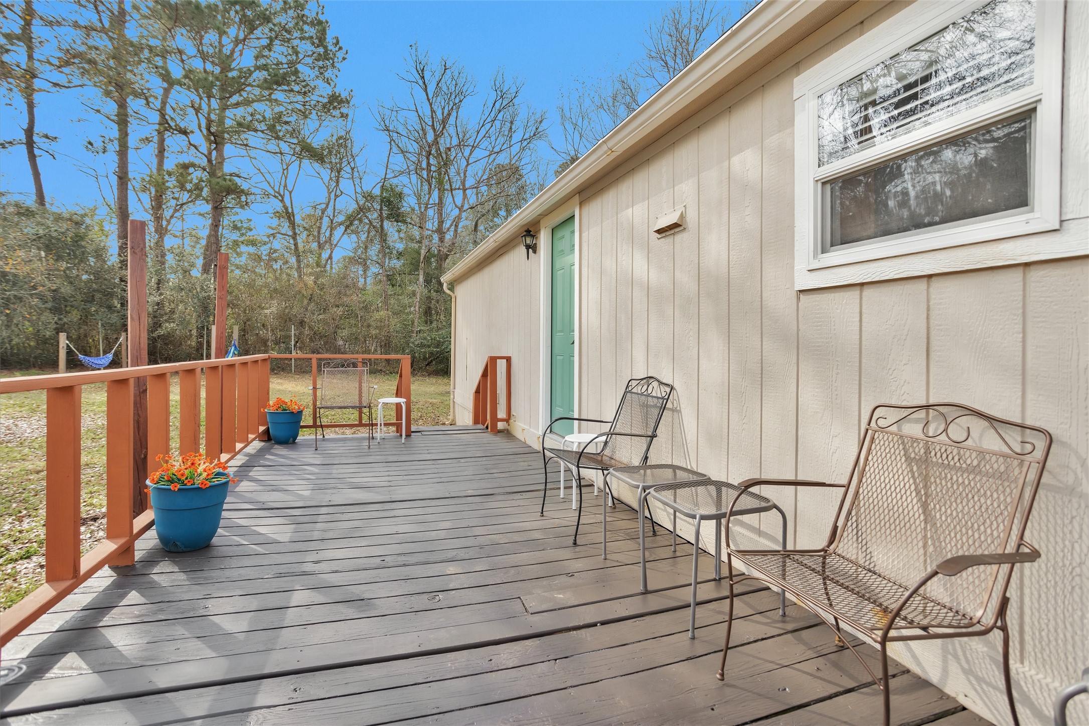 14604 Hasara Lane Willis, TX 77378 - Photo 39 of 50 a view of a balcony with chairs and wooden fence