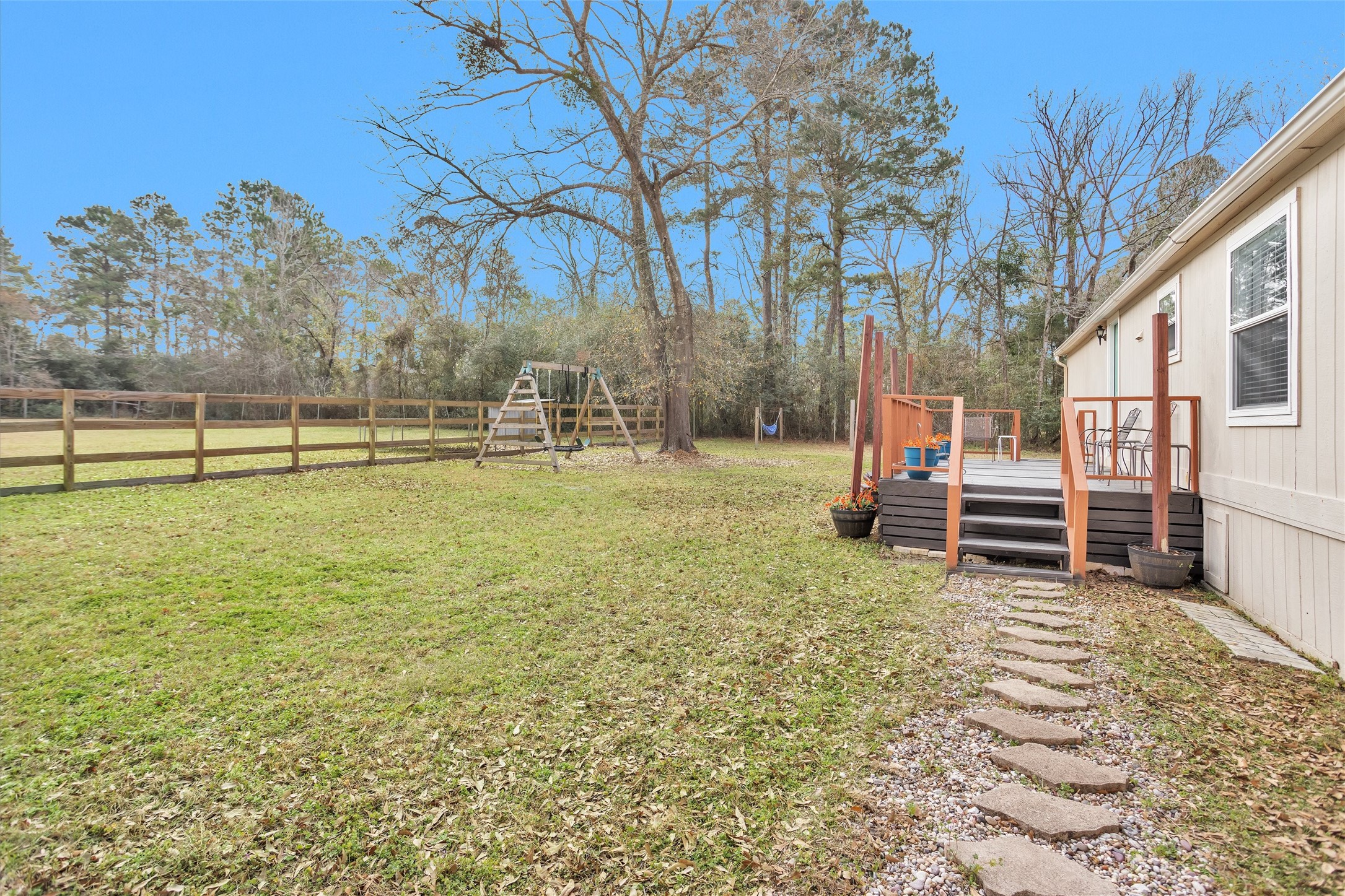 14604 Hasara Lane Willis, TX 77378 - Photo 40 of 50 a view of a playground with a bench and trees