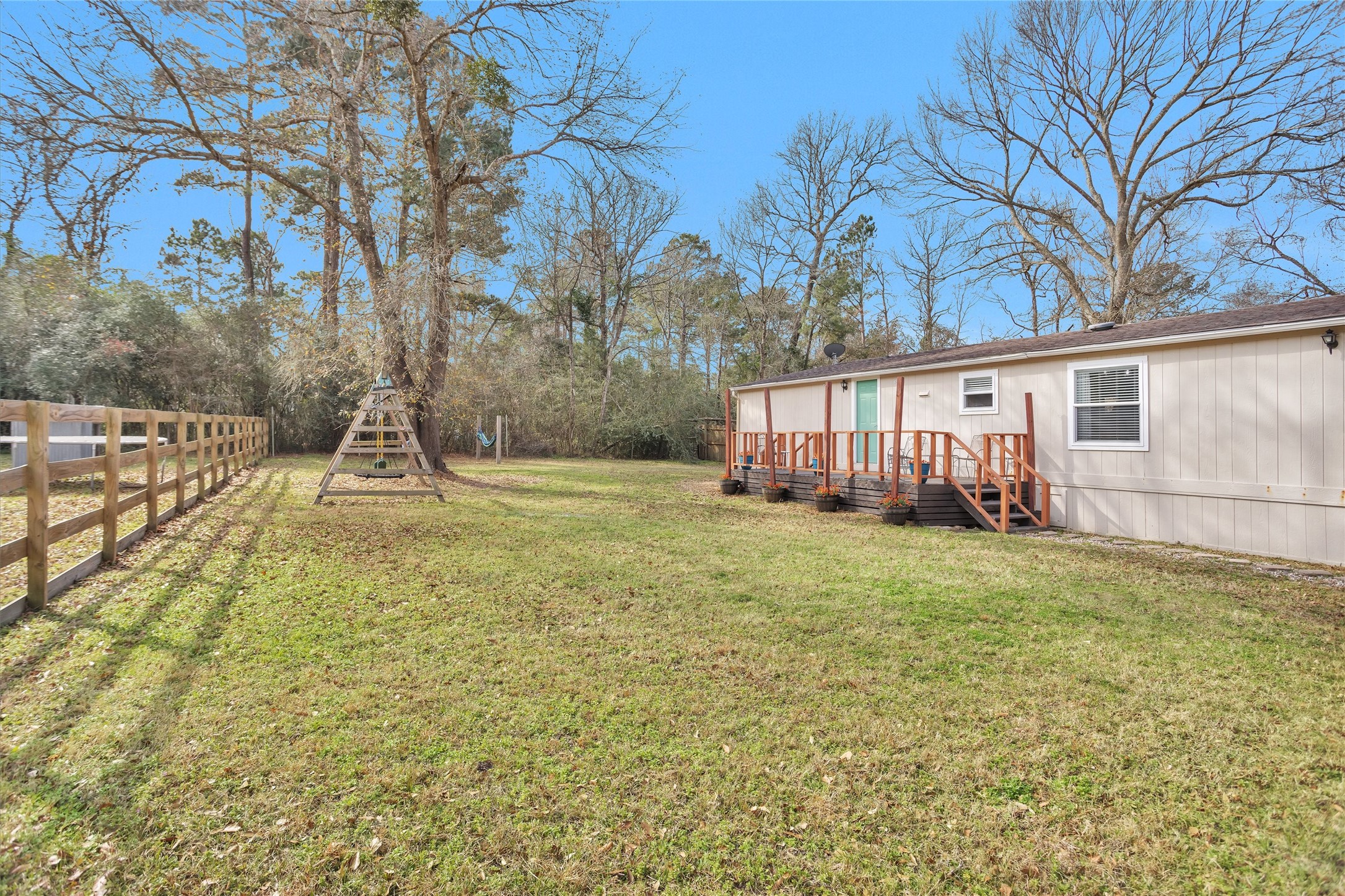 14604 Hasara Lane Willis, TX 77378 - Photo 41 of 50 a view of a house with backyard and a tree