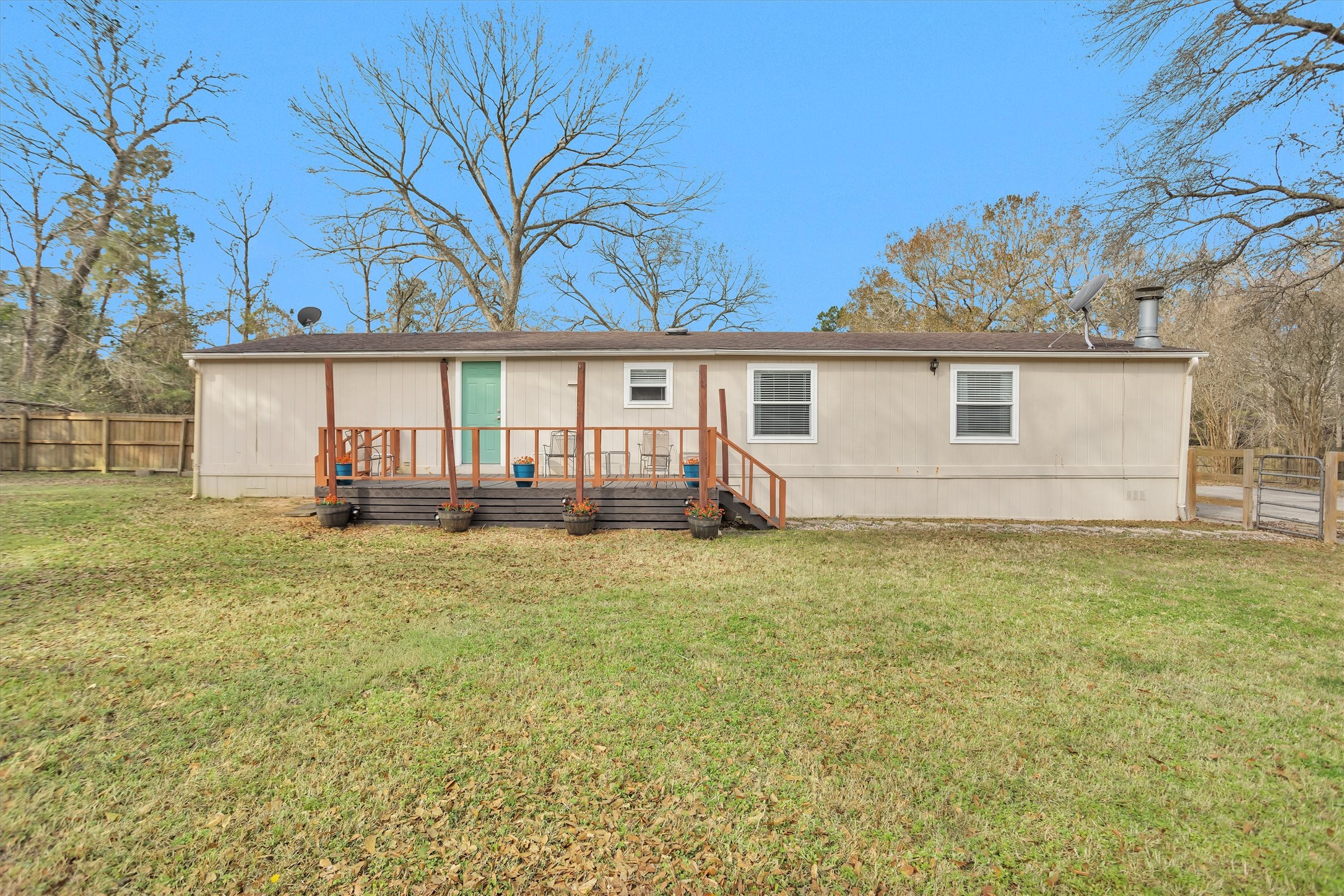 14604 Hasara Lane Willis, TX 77378 - Photo 42 of 50 a front view of house with yard and green space