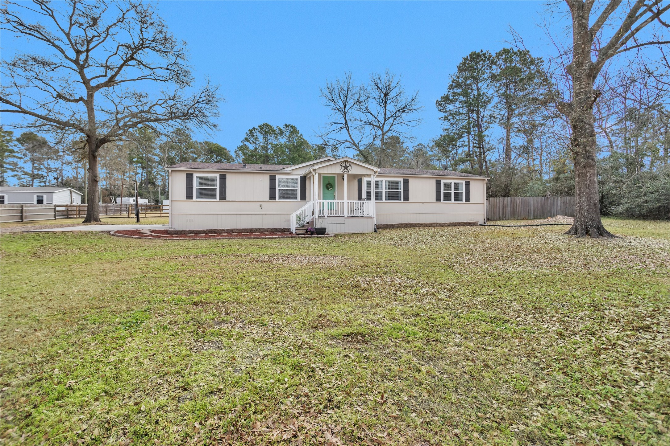 14604 Hasara Lane Willis, TX 77378 - Photo 6 of 50 a white house that has a tree in front of it