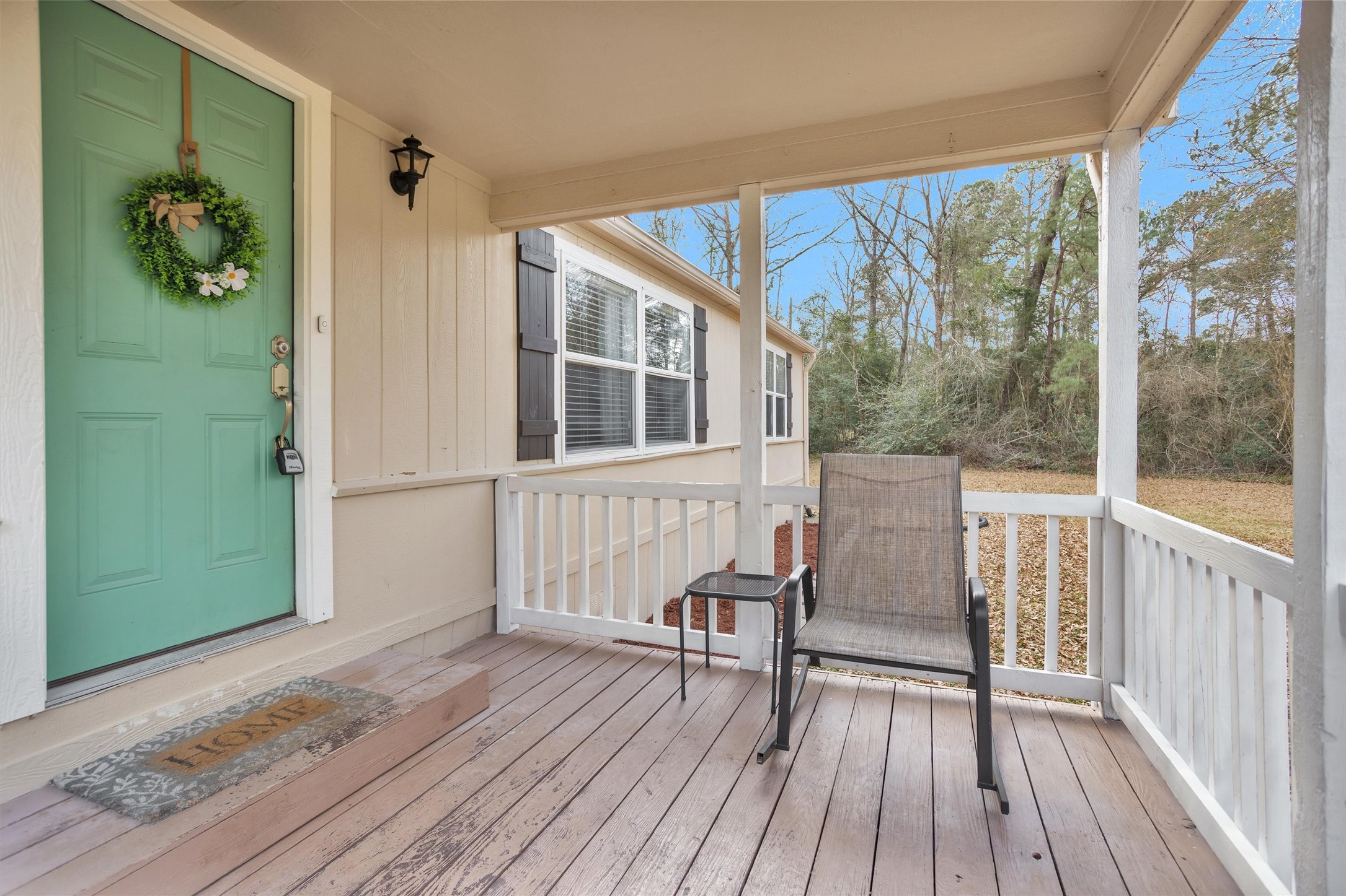 14604 Hasara Lane Willis, TX 77378 - Photo 9 of 50 a view of a balcony with chair and wooden floor