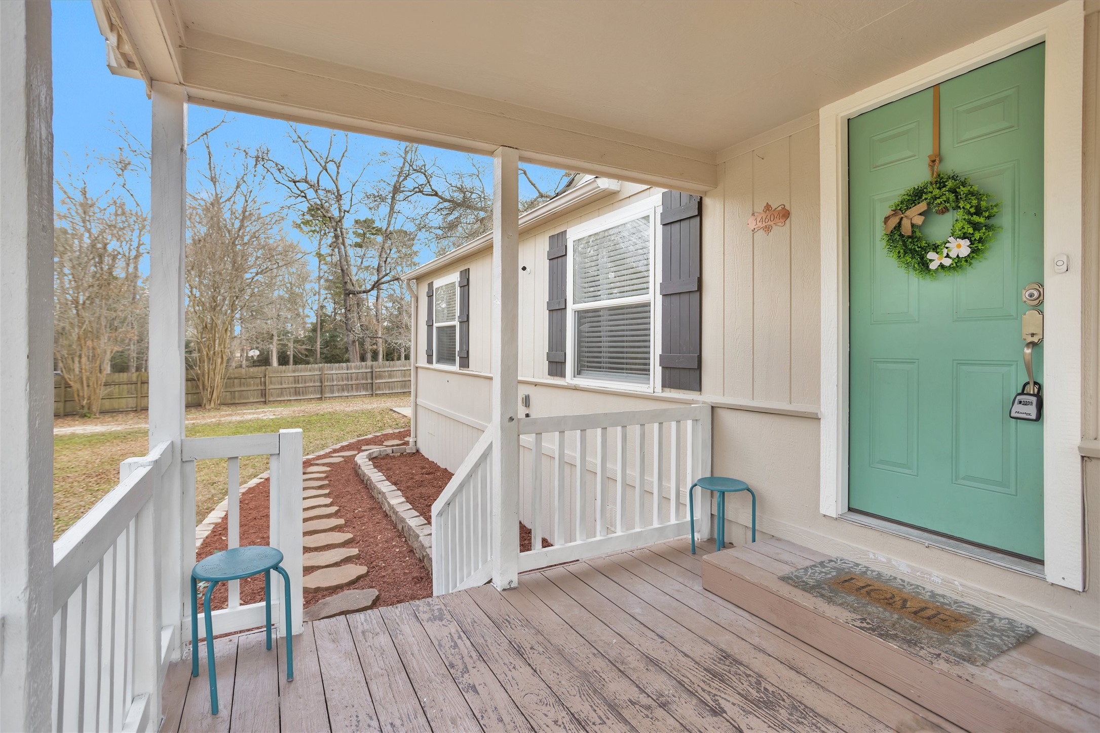 14604 Hasara Lane Willis, TX 77378 - Photo 10 of 50 a view of a balcony with wooden floor and outdoor seating