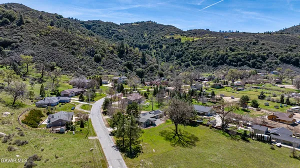 an aerial view of a house with outdoor space