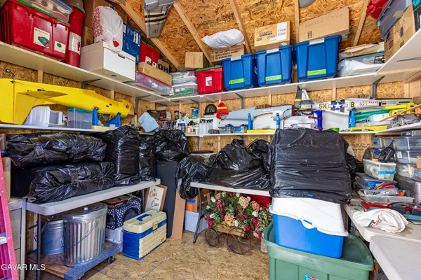 a dining room with furniture a chandelier and window