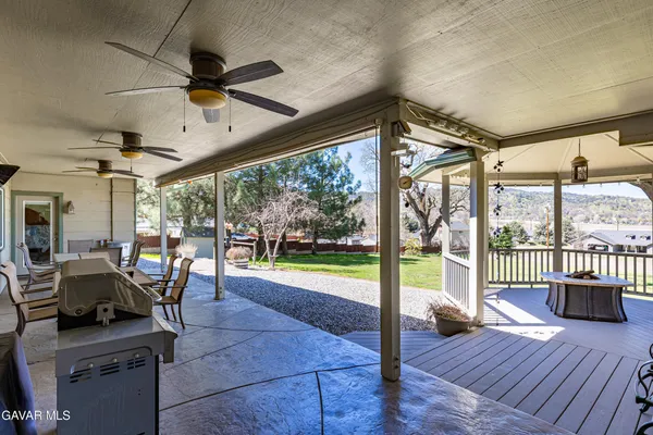 a kitchen with stainless steel appliances granite countertop a stove a refrigerator and a microwave