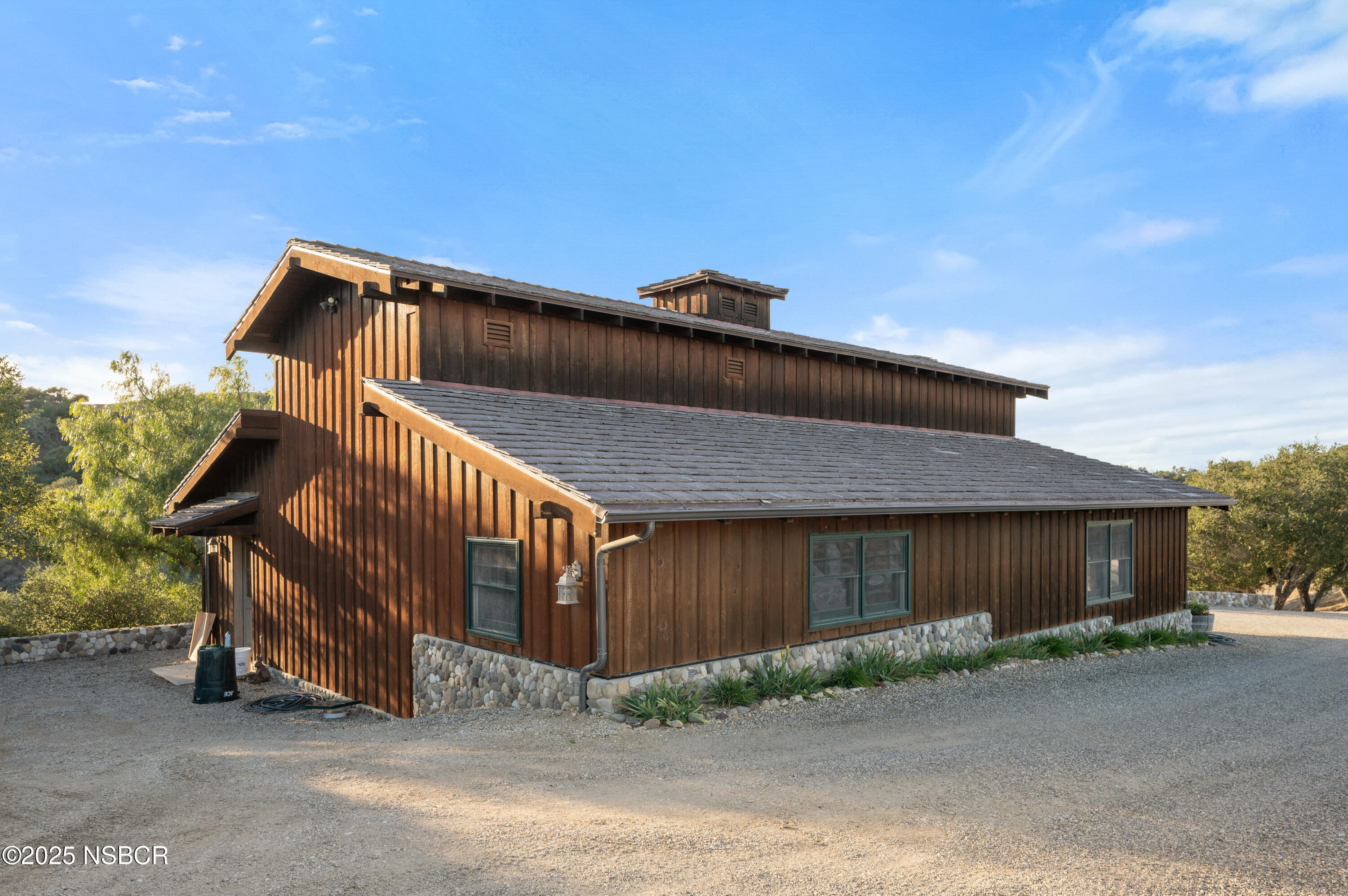 4086 East Oak Trail Road Santa Ynez, CA 93460 - Photo 47 of 57 a front view of a house with a yard