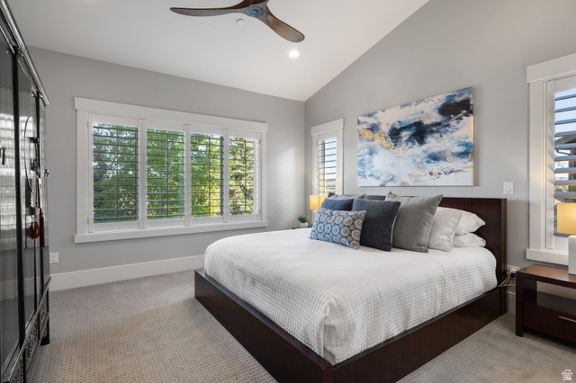 1737 East Viewside Circle Hideout, UT 84036 - Photo 13 of 35 Vaulted ceiling bedroom featuring a large window with plantation shutters, recessed lighting, and a contemporary ceiling fan