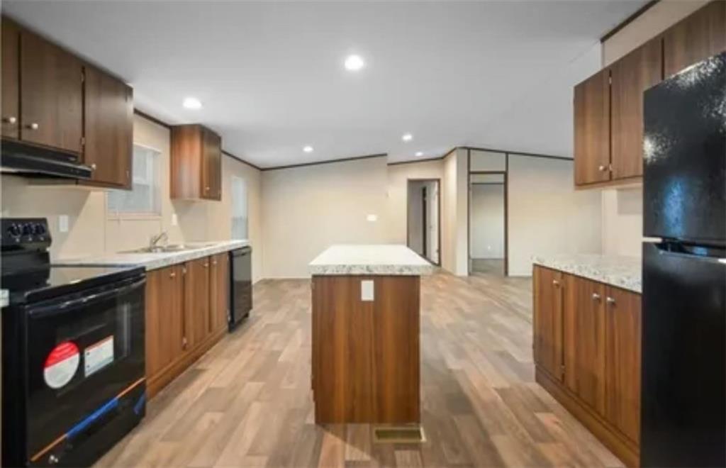 0 Ruby Ridge Drive Talking Rock, GA 30175 - Photo 3 of 17 a kitchen with stainless steel appliances granite countertop a stove a refrigerator a sink dishwasher and wooden cabinets with wooden floor