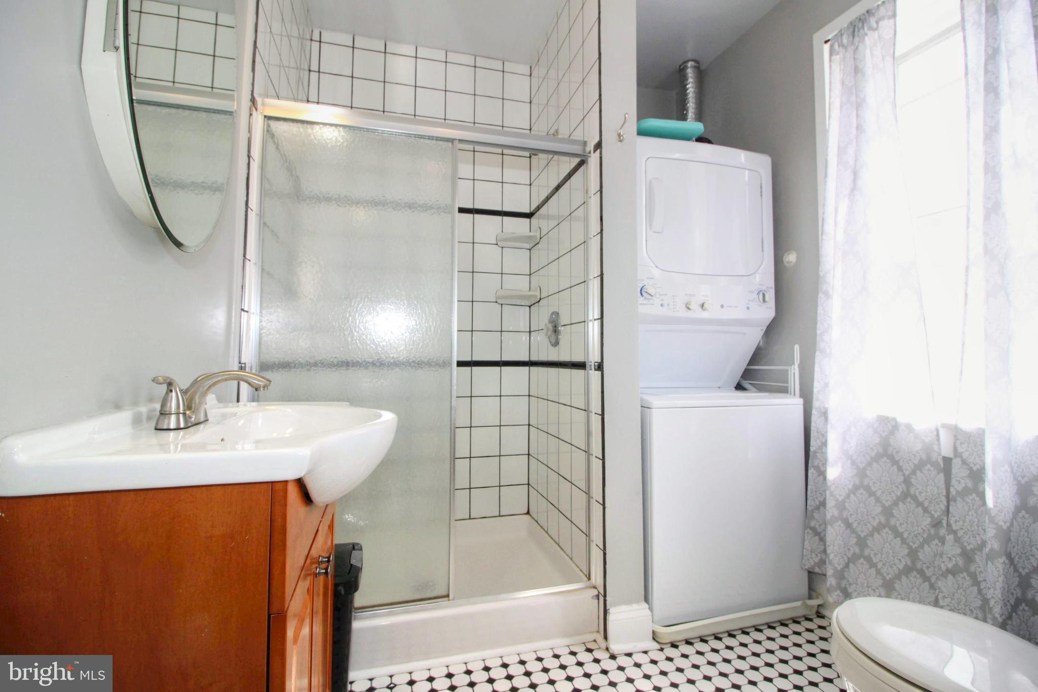 22 North Market Street, Unit 3 Frederick, MD 21701 - Photo 13 of 16 a bathroom with a sink toilet and shower