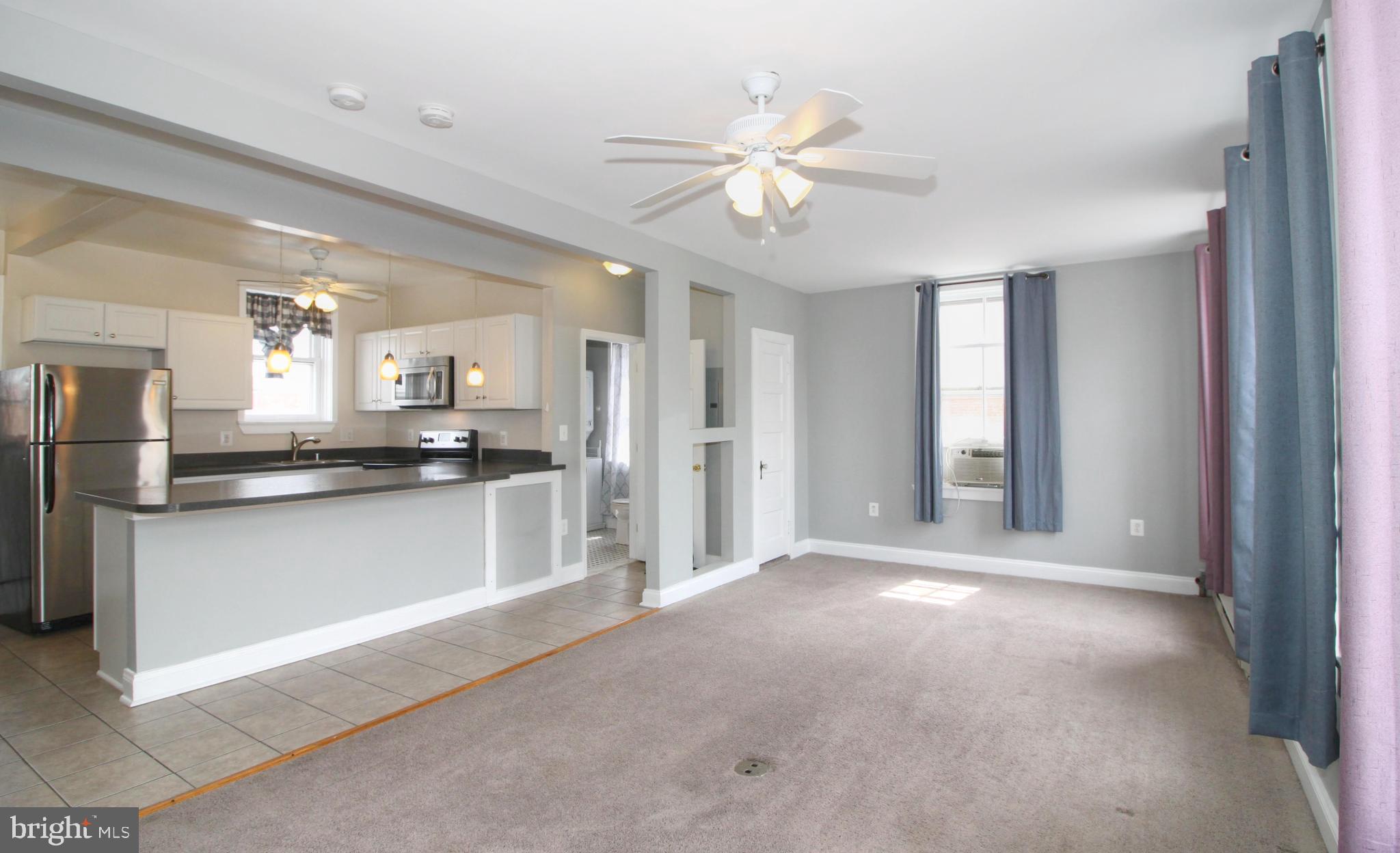 22 North Market Street, Unit 3 Frederick, MD 21701 - Photo 8 of 16 a view of kitchen with refrigerator and window