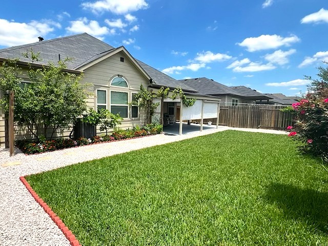 2020 Cedar Tree Court Conroe, TX 77301 - Photo 4 of 26 Even the backyard is beautifully maintained & manicured & boasts fruit trees - peach, fig & pomegranate. Backyard is fenced & plenty of room for kids & pets to roam