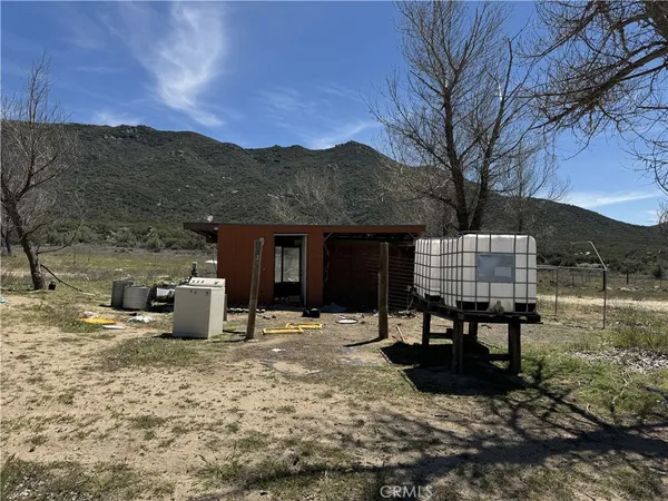 a view of a chairs and table in the patio