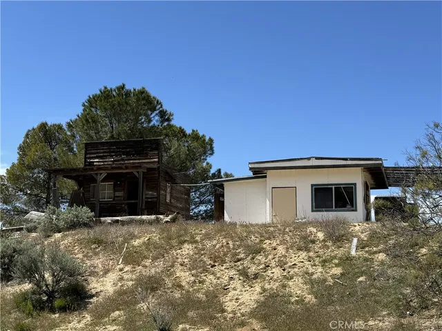 a view of a house with a yard and garage