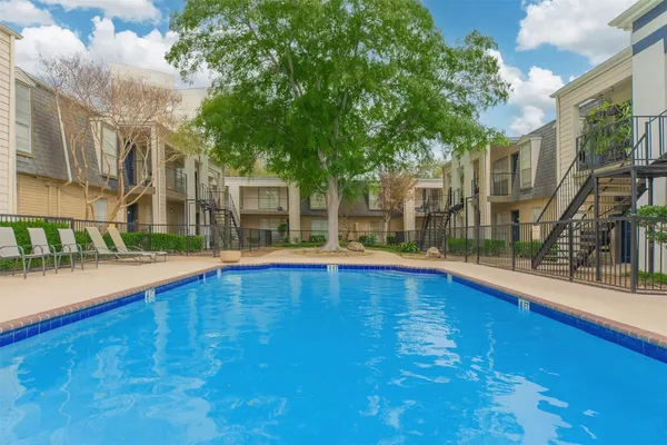 a view of indoor pool and deck