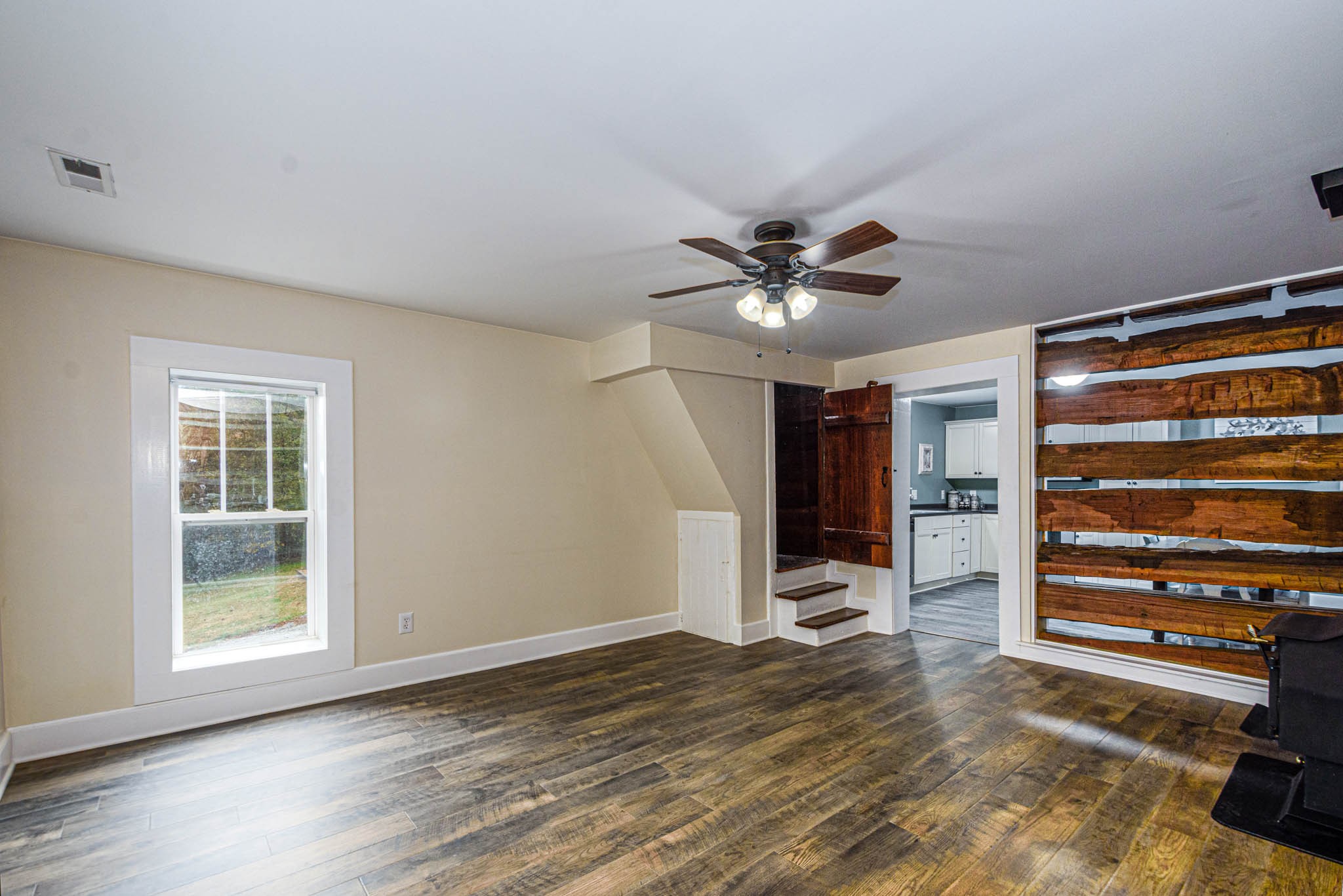 1828 Bunker Hill Road Pulaski, TN 38478 - Photo 11 of 57 a view of a livingroom with a hardwood floor and ceiling fan