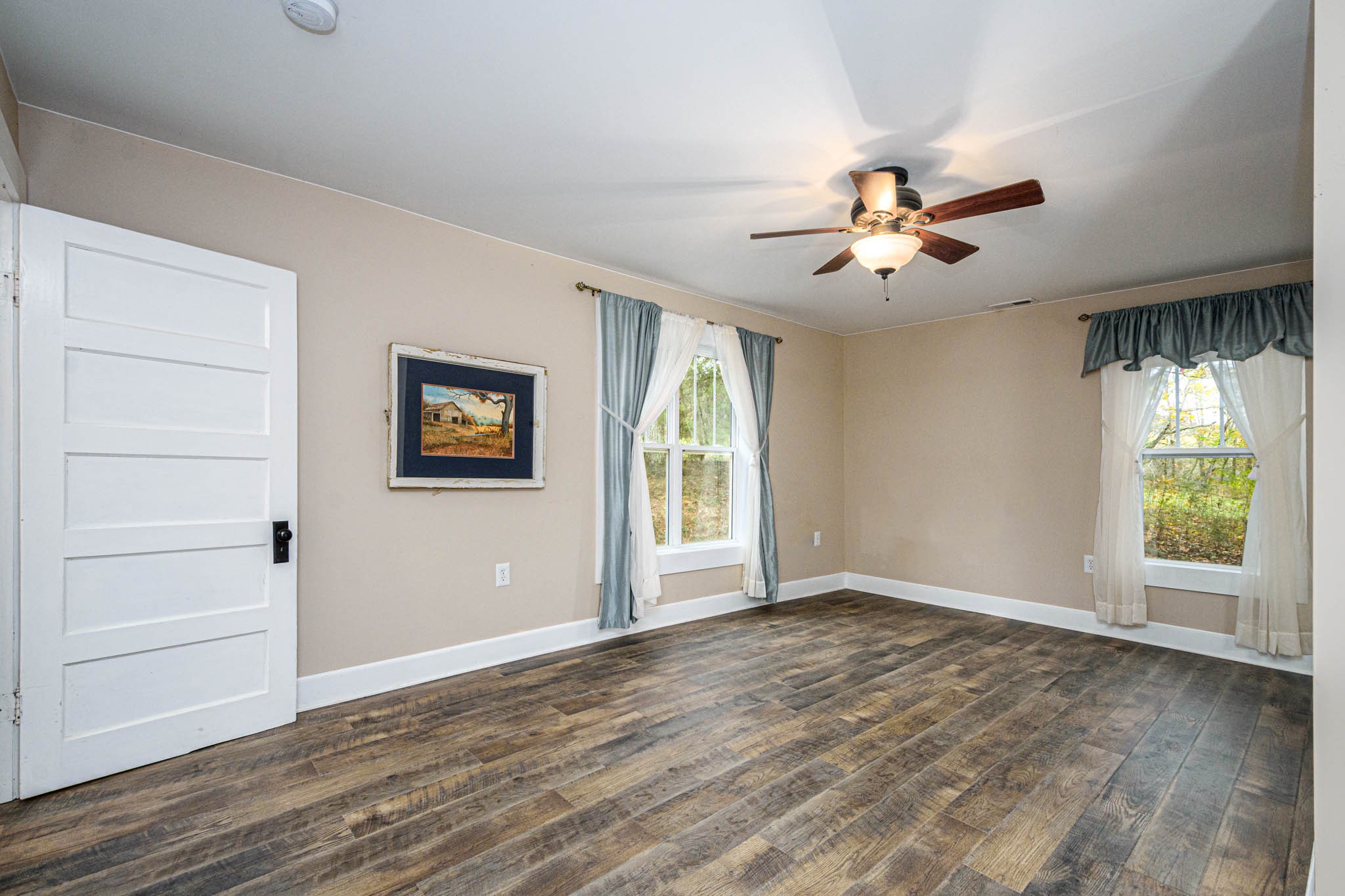 1828 Bunker Hill Road Pulaski, TN 38478 - Photo 20 of 57 a view of an empty room with a window and wooden floor