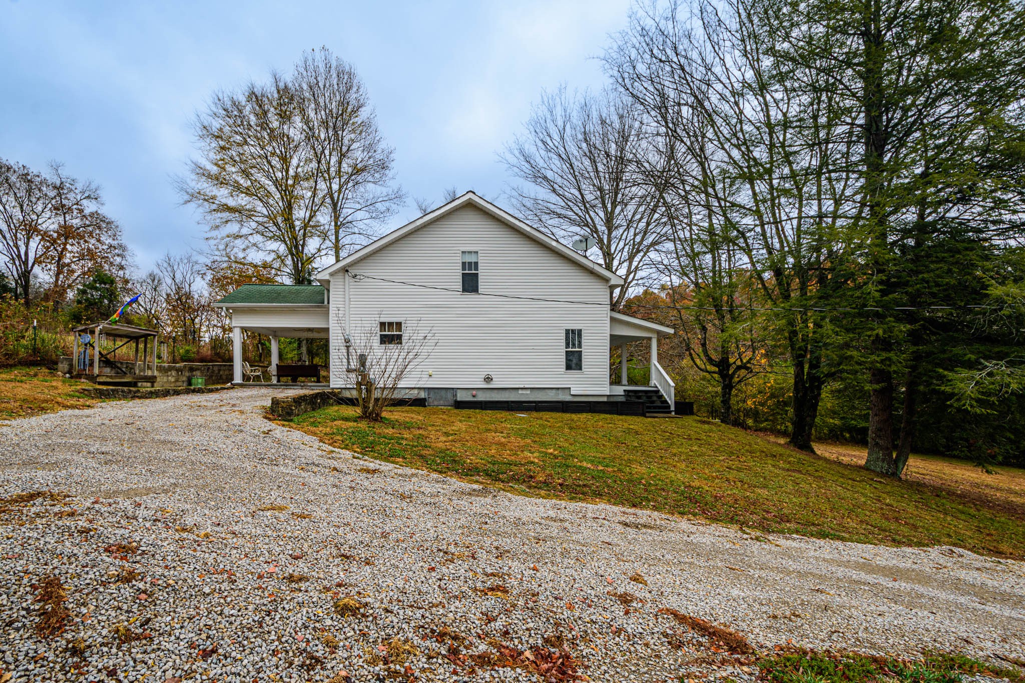 1828 Bunker Hill Road Pulaski, TN 38478 - Photo 43 of 57 a view of a yard in front of a house with large trees
