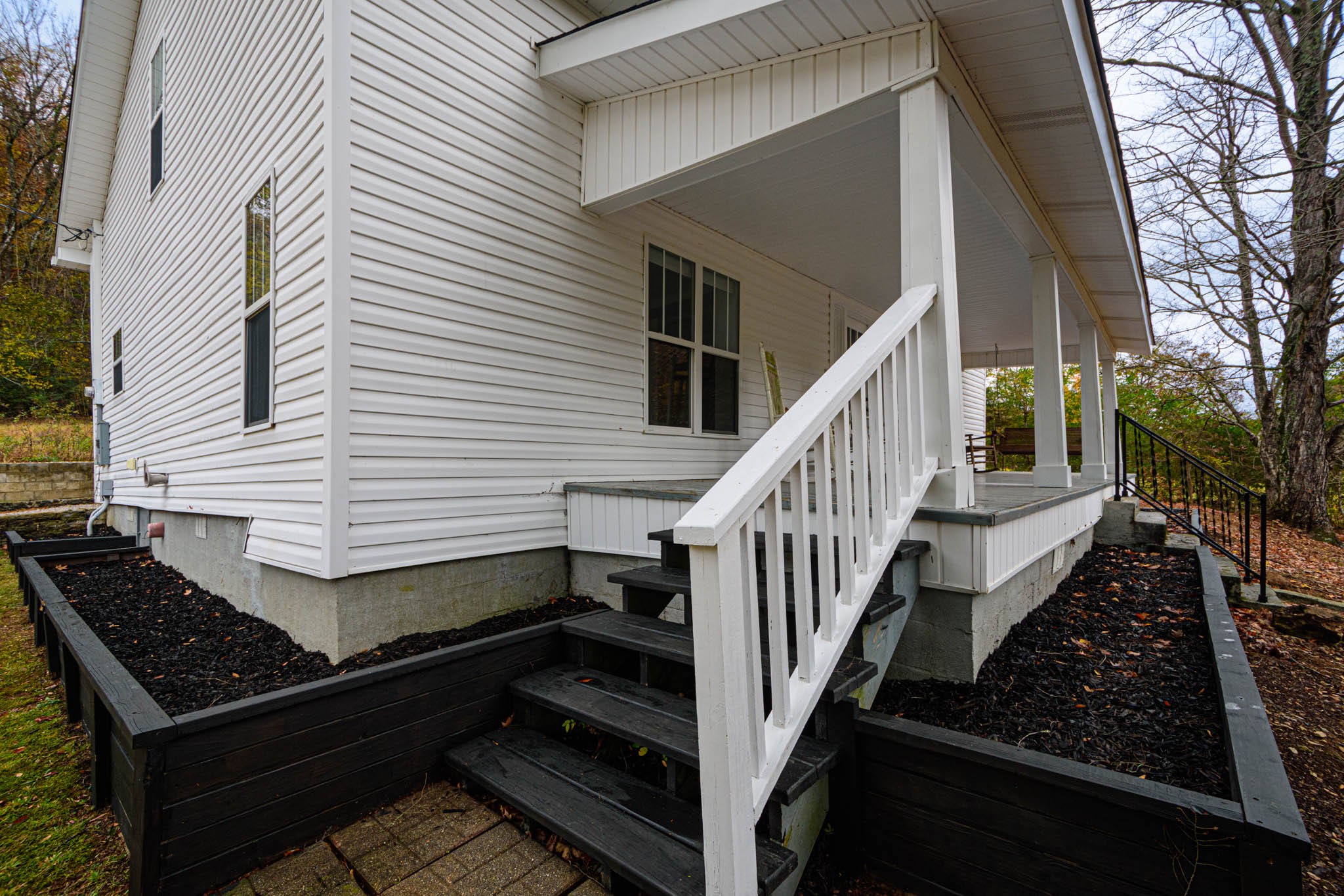 1828 Bunker Hill Road Pulaski, TN 38478 - Photo 47 of 57 a view of a house with barbeque and wooden stairs