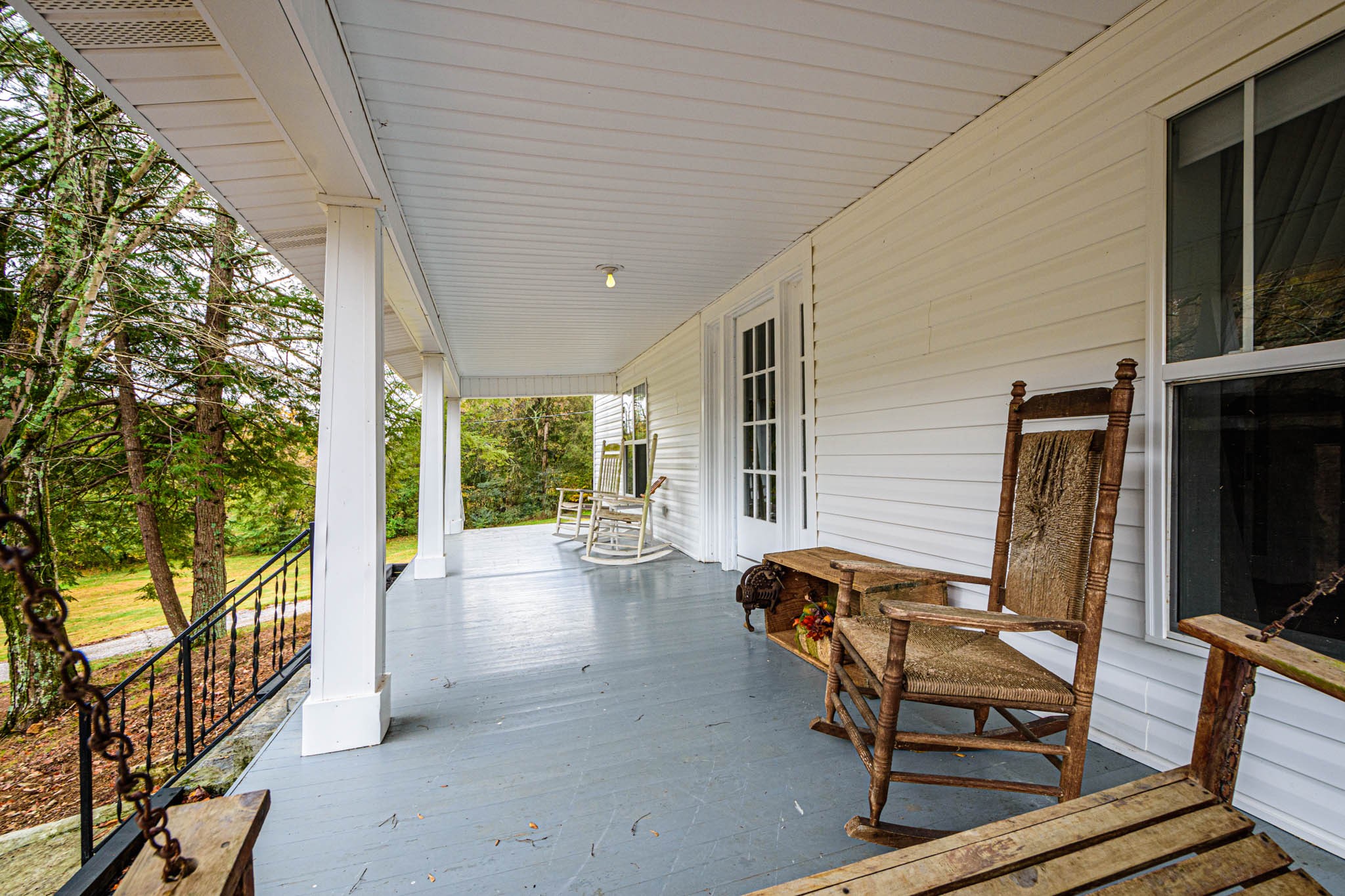 1828 Bunker Hill Road Pulaski, TN 38478 - Photo 49 of 57 a view of a patio with table and chairs and floor to ceiling window with wooden floor