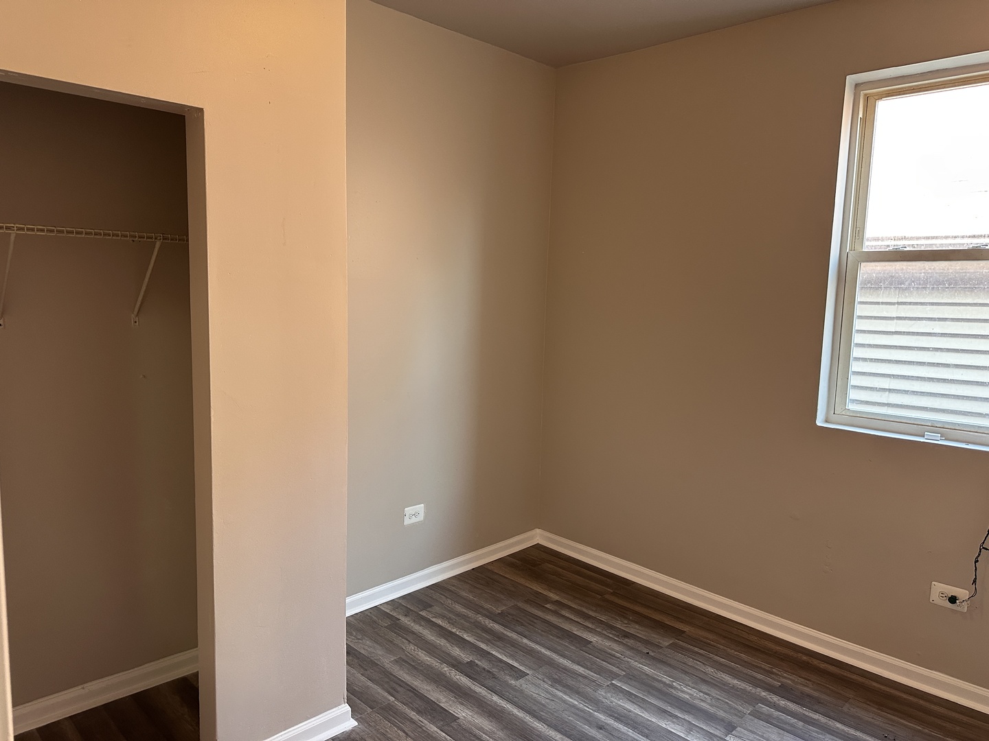 4107 West 16th Street Chicago, IL 60623 - Photo 13 of 29 a view of a small space with wooden floor and a window