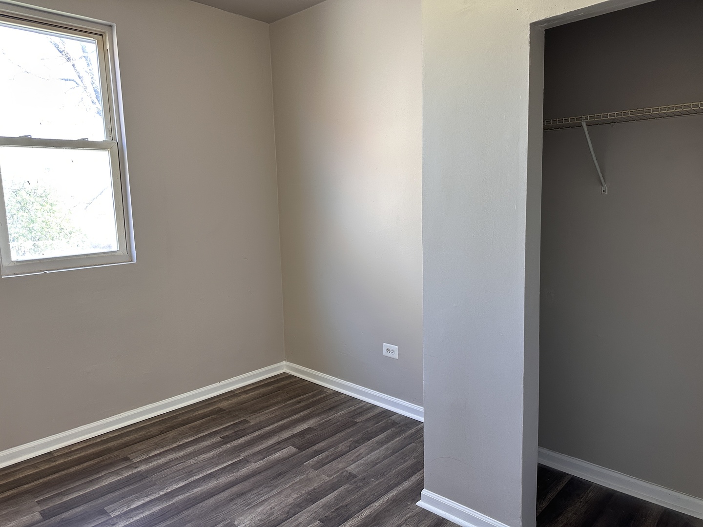 4107 West 16th Street Chicago, IL 60623 - Photo 24 of 29 a room with a window and wooden floor