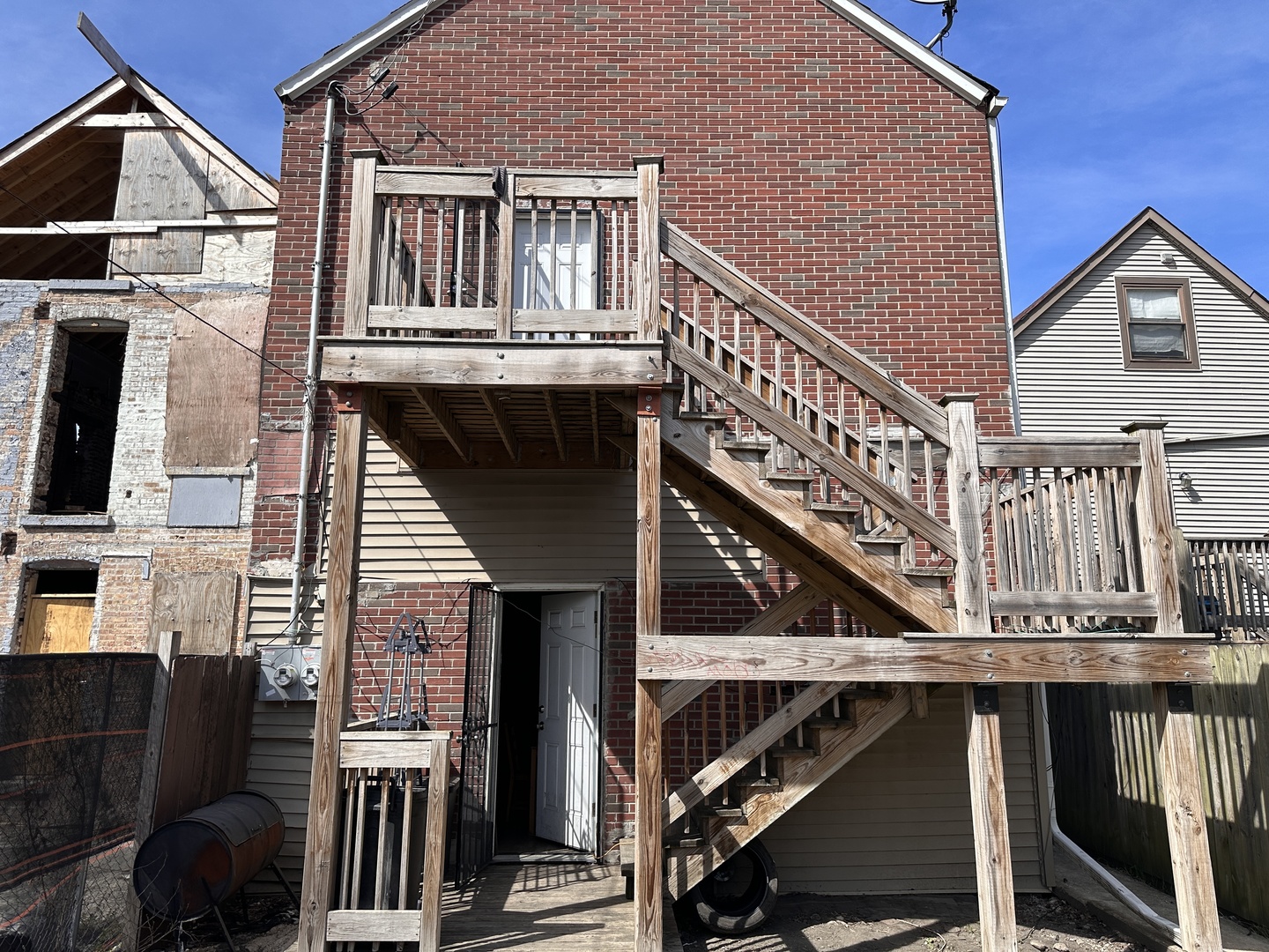 4107 West 16th Street Chicago, IL 60623 - Photo 29 of 29 a view of balcony with wooden stairs and furniture