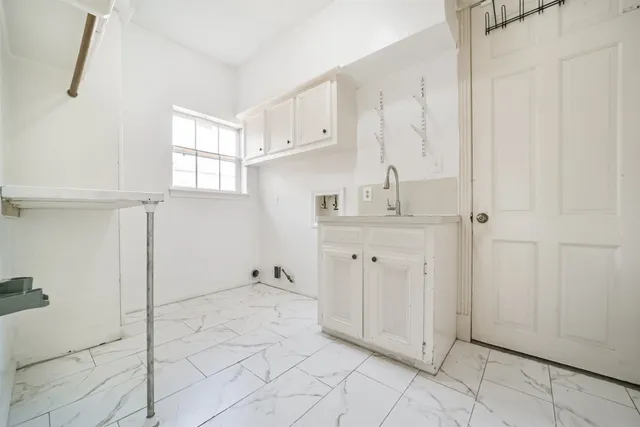 a view of cabinets with white walls
