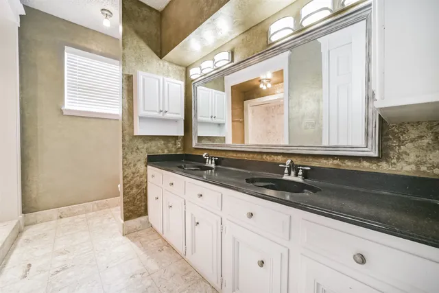 a bathroom with a sink and a bathtub