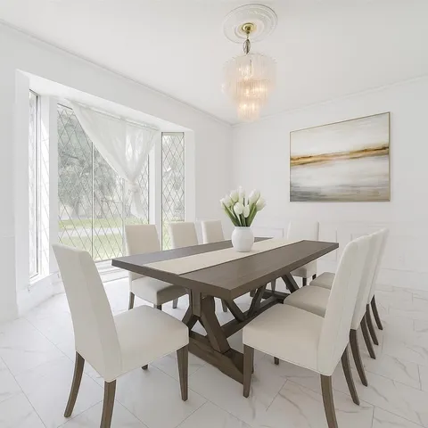 a view of a dining room with furniture and window