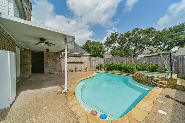 a view of a swimming pool with a patio